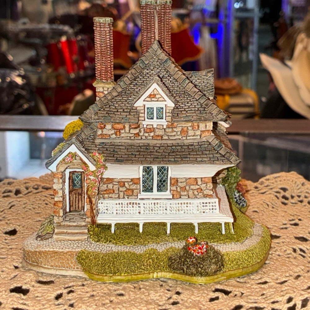 Charming Cottage Figurine with Green Accents